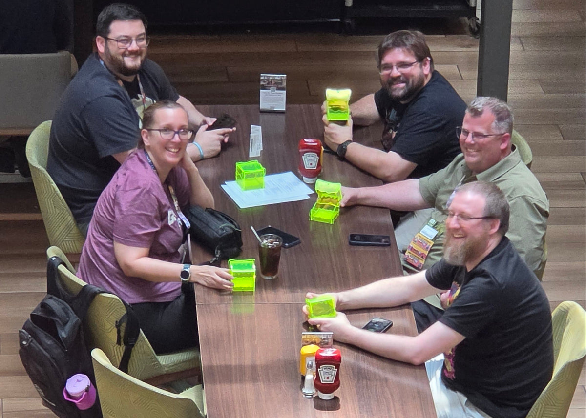 An after-class shot captured from the class area above the hotel lobby of a group of participants who had all taken the class and were excited to show off their Jelly Boxes. We first saw them because the boxes were SO visible from so far away!